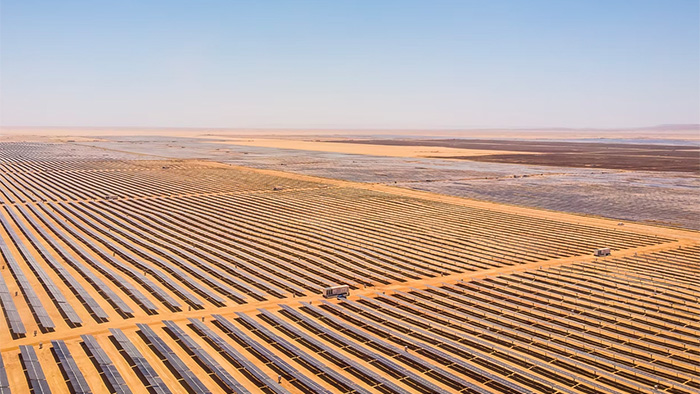 An aerial photo of the Benban Solar Park in Egypt, with rows of solar panels spanning as far as the eye can see.